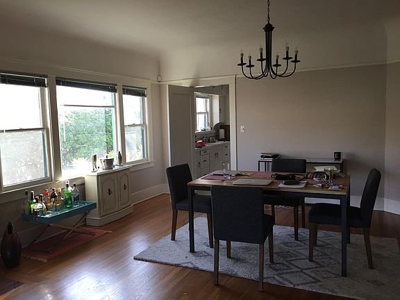 Dining room, different furniture. Very large cohesive space. Many ways to organize it.