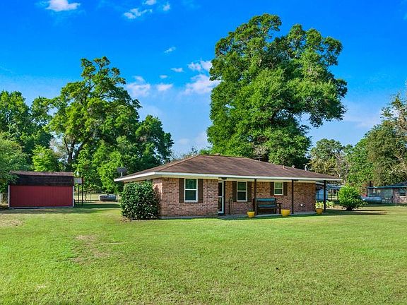 2 sprawling acres, fully fenced with lush mature trees.