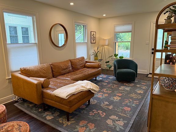 Cozy and bright light in living room. Original wood floors from 1950 throughout.