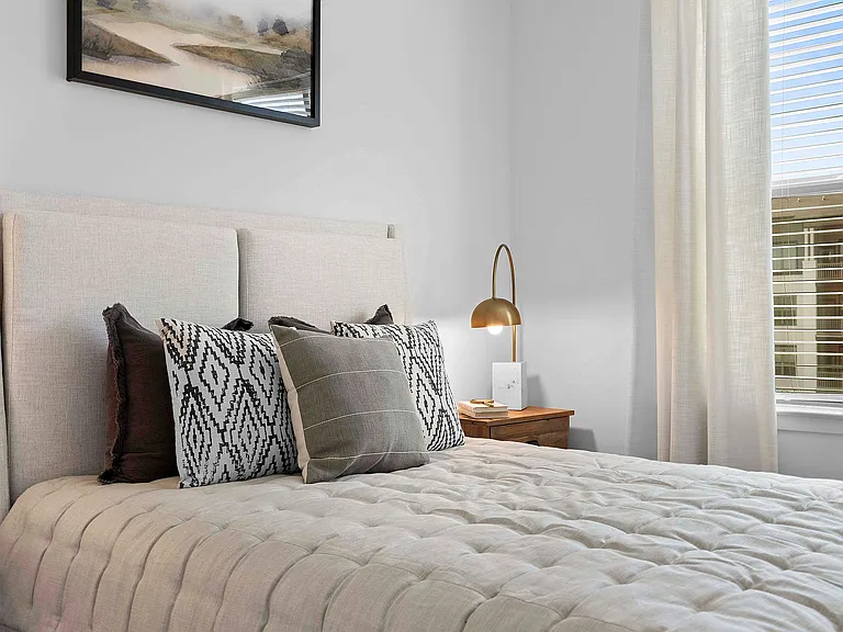 Step into comfort and style with this elegantly designed bedroom.