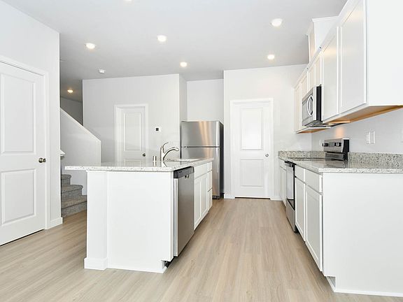 Each kitchen comes with stainless steel appliances.