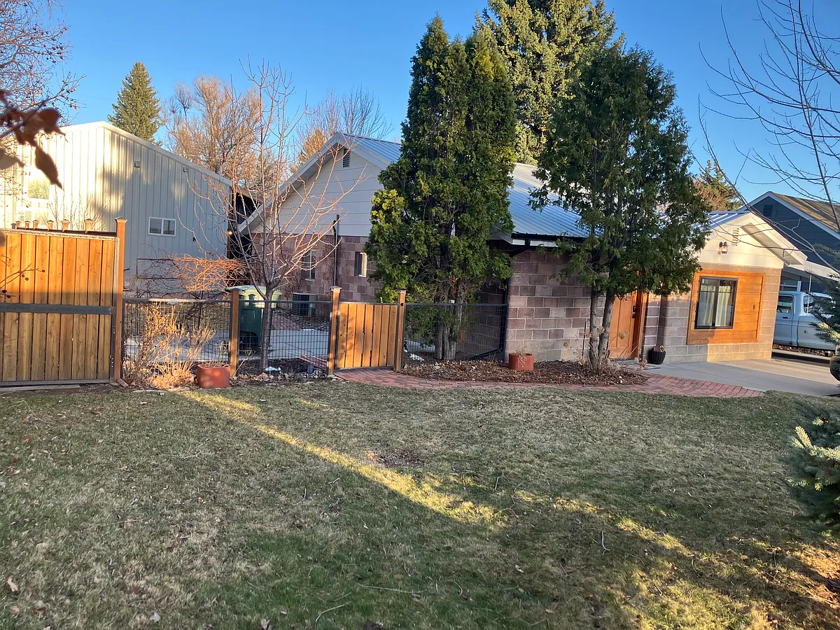 NW side of house. Responsive landlord/neighbors in rear of lot. Tenant's fenced yard with large patios, and designated garden areas in back. - 2603 Copper Blvd
