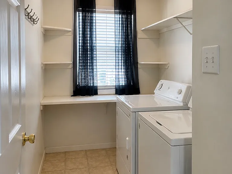 Laundry room. Washer and dryer included.