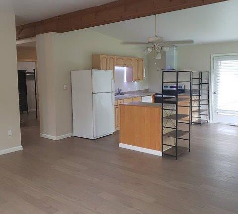 Common space with hall to sleeping area and Bathroom