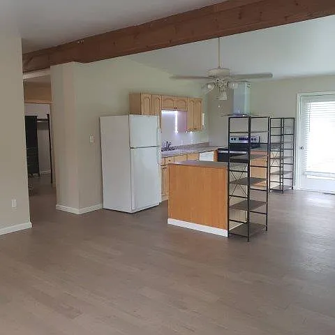 Common space with hall to sleeping area and Bathroom