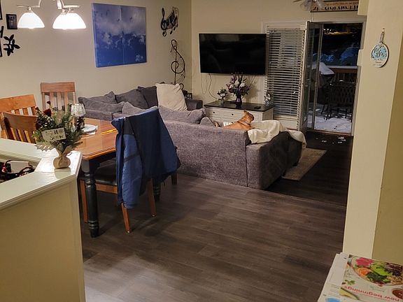 Dining and family room from bottom of second level stairs perspective.