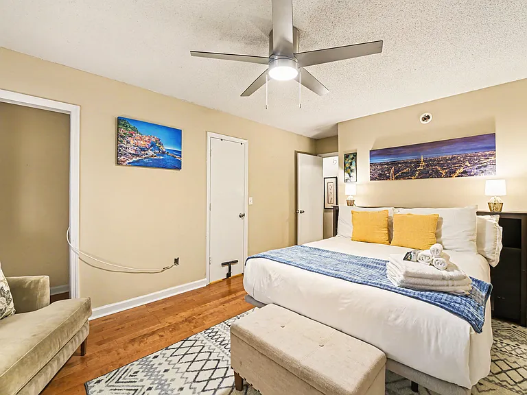 Bedroom 2 with queen bed, Smart TV, and 2 closets