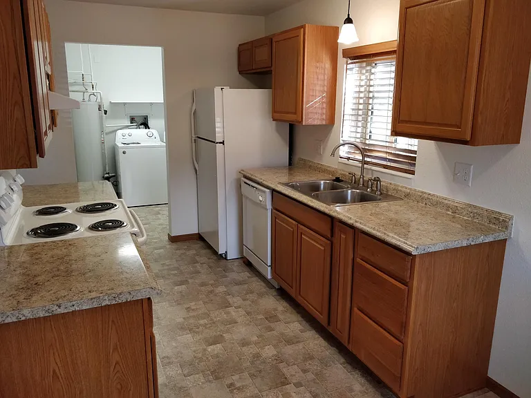 From dining area looking thru kitchen towards laundry.