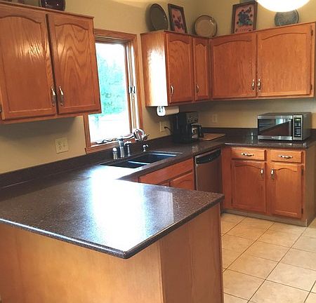 Kitchen with granite countertops and all stainless appliances