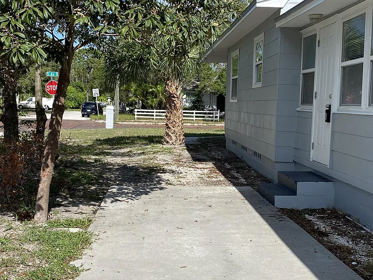 Side parking pad, accessible to side entrance