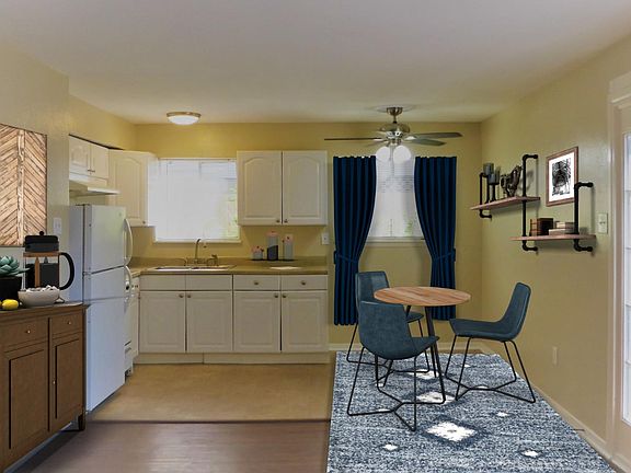 Living area, breakfast nook and kitchen. Lots of natural light