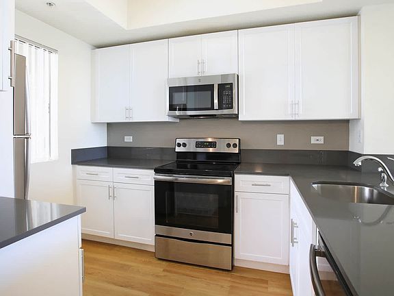 Kitchen with Stainless Steel Appliances and Quartz Countertops