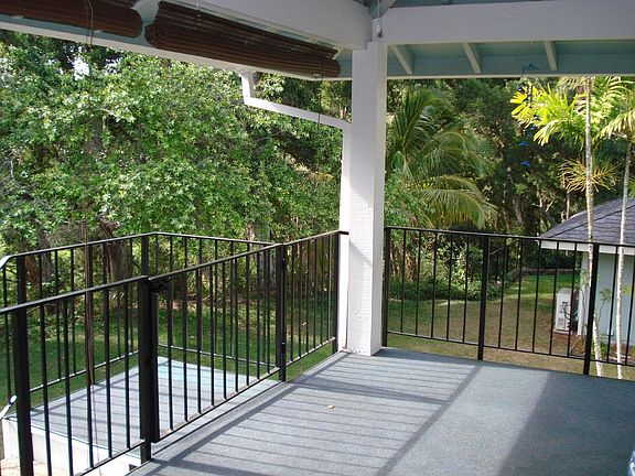 Serene Tropical View from Covered Lanai with Ceiling Fan