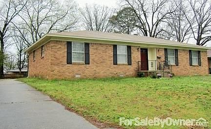 Driveway leads to rear garage.