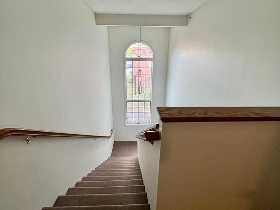 The tall ceiling and lots of light in the hallway