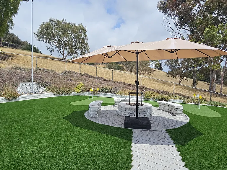 Outdoor area is great for fires, griling, or just hanging out. Umbrella canopy, and Santa Maria grill included with house!