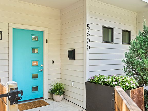 Front door with large planter in the front