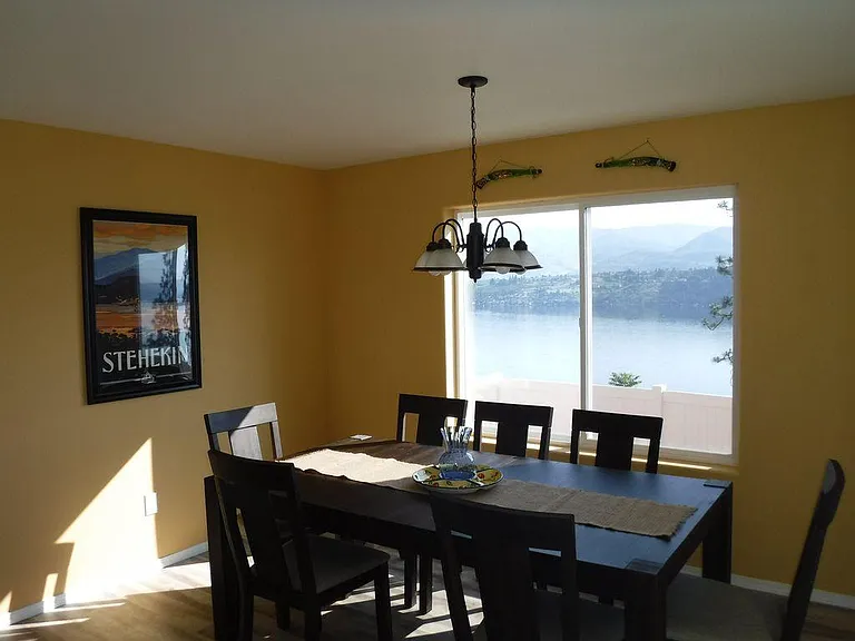 Open dining room area in the morning light with great lake views.