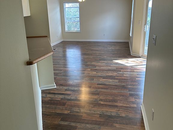 Hallway at entrance, bar to kitchen