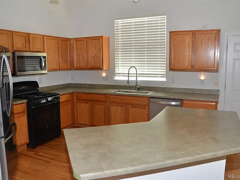 6123 S Quemoy Way — Photo 5