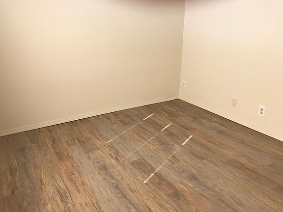New wood laminate floor in master bedroom