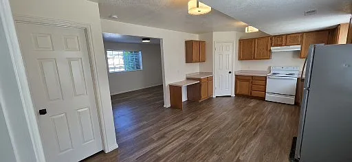 Kitchen, Corner Pantry, and Door to Half Bathroom