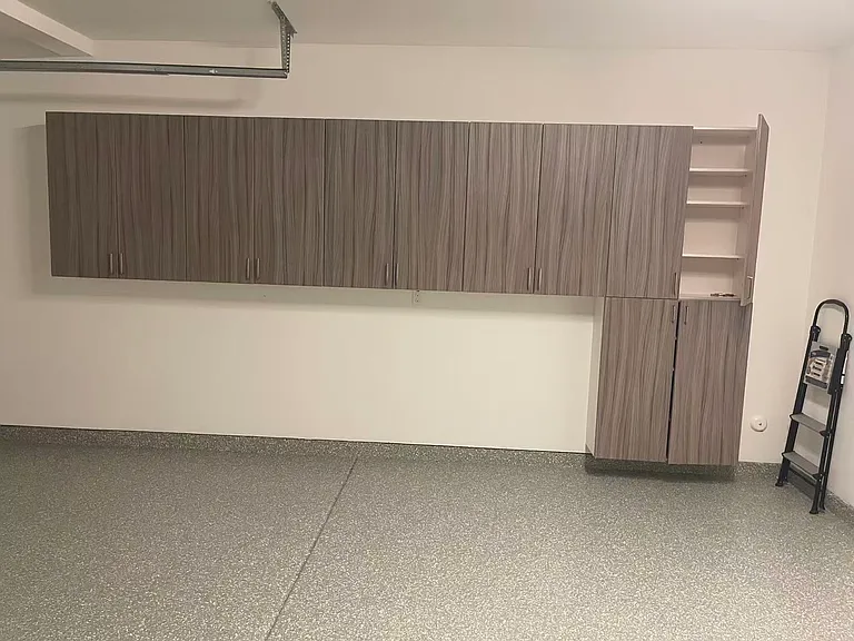 The garage with cabinets.