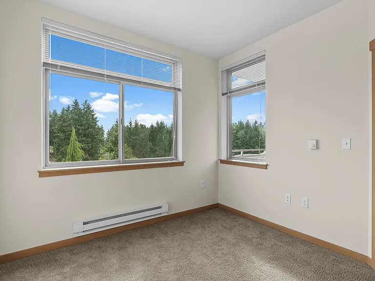 Bright bedrooms with large windows and soft carpeting. Bright bedrooms with large windows and soft carpeting.