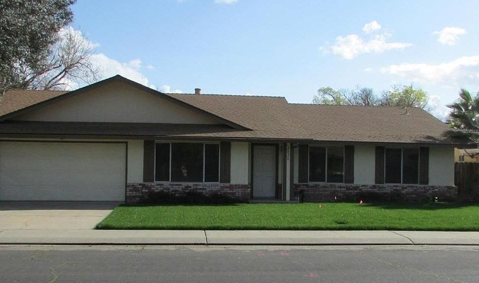 Front exterior, new sod and two car garage.