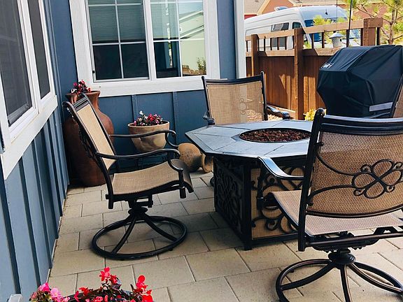 Patio with gas grill and fire pit.