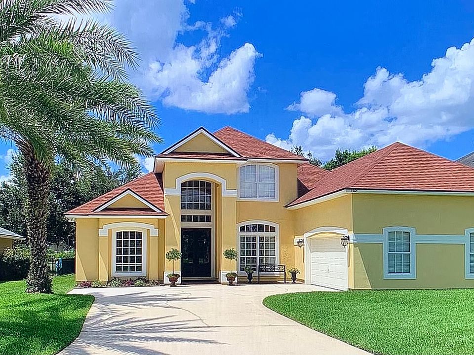 Tucked away Holmes Landing with courtyard entry and 3 car garage and storage (one bay 3 + spaces ) New exterior paint and Roof