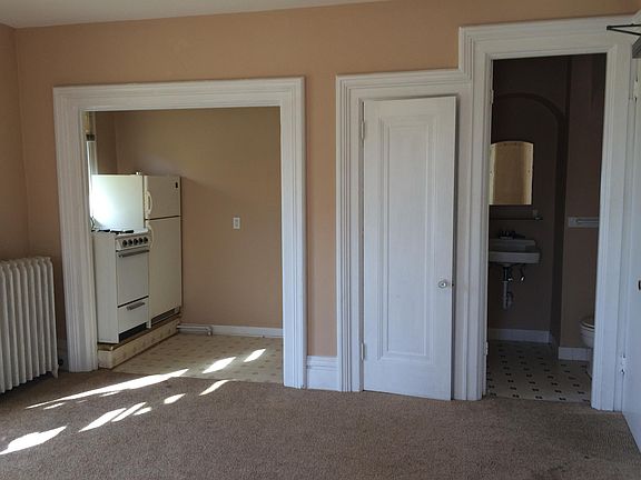 Kitchen alcove, closet door and entrance to bathroom