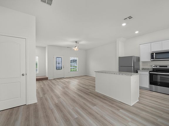 Beautiful vinyl flooring throughout the first floor