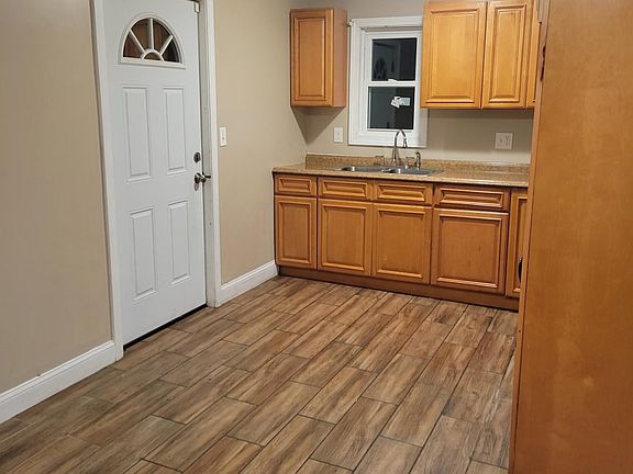 Kitchen cabinets are now white.