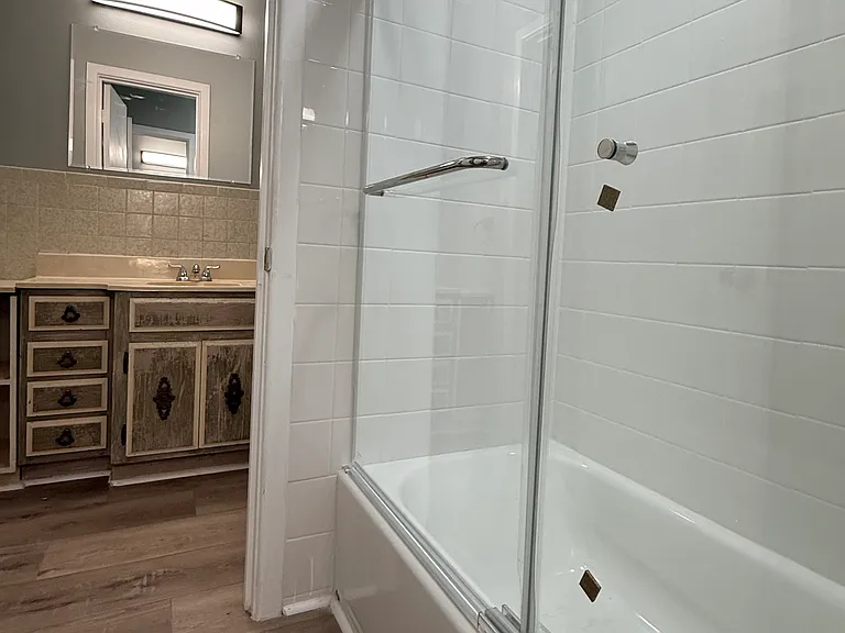 Looking from the bathtub area to the 2nd 1/2 bath.