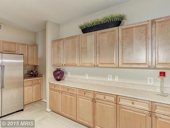 Large open kitchen features oodles of cabinets