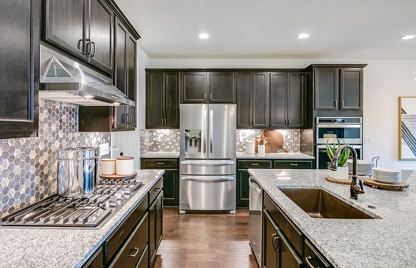 Enjoy a designer kitchen with stainless-steel appliances.