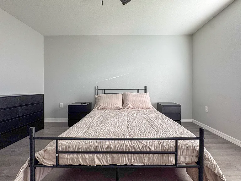 Bright, comfortable bedroom perfect for family, guests, or a home office.