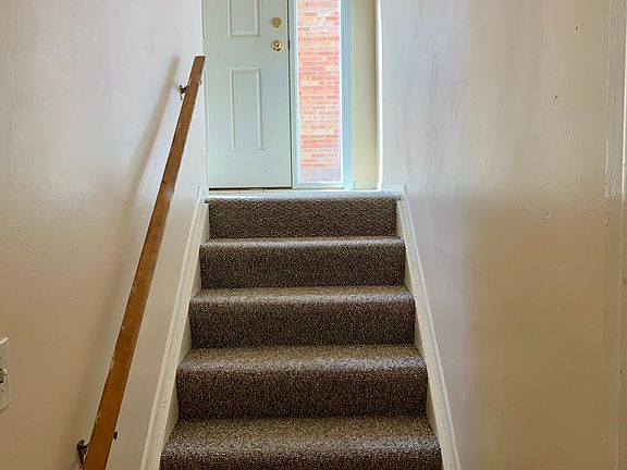 MAIN ENTRANCE: Steps leading to upper level on the left, steps to the lower level on the right.
