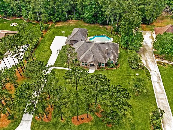 Space to roam! House is centered on this oversized lot. Property goes beyond trees in rear. Only cleared a portion to maintain privacy in back yard. See Documents for a sketch of how lot dimensions are shown.