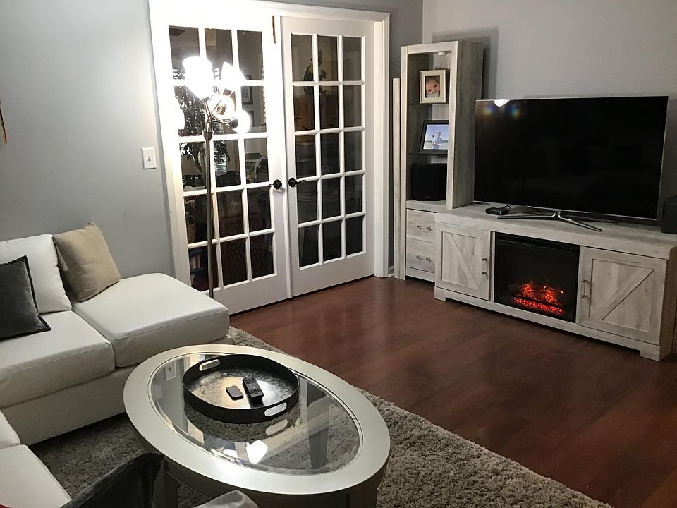The living room will be unfurnished. French doors leading to sunroom.