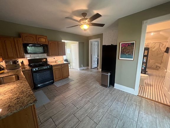 Huge Kitchen. Deluxe appliances including virtually silent Bosch dishwasher, OTR microwave, massive refrigerator with Ice/Water, Ceramic tile floors, and room for a dining or cafe table