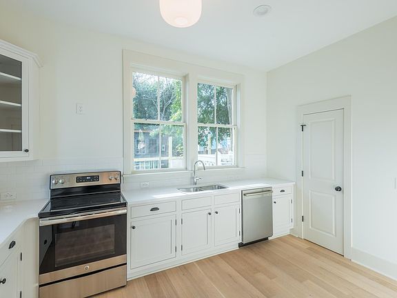 To the right of the kitchen is a half bathroom - great for entertaining! To the right of the half bathroom is a pantry.