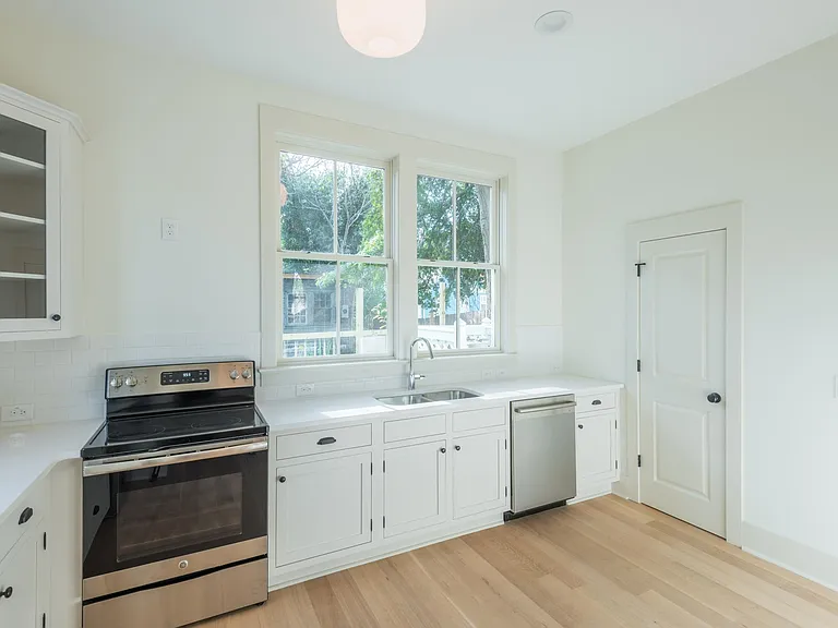To the right of the kitchen is a half bathroom - great for entertaining! To the right of the half bathroom is a pantry.