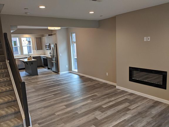 Kitchen leads into the dining and living rooms