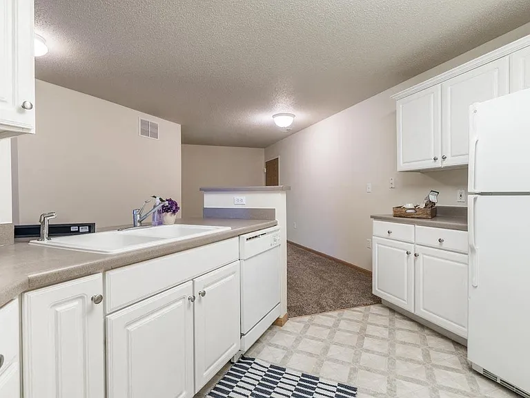 Prepare meals with ease in a kitchen featuring plenty of counter space and a practical layout.
