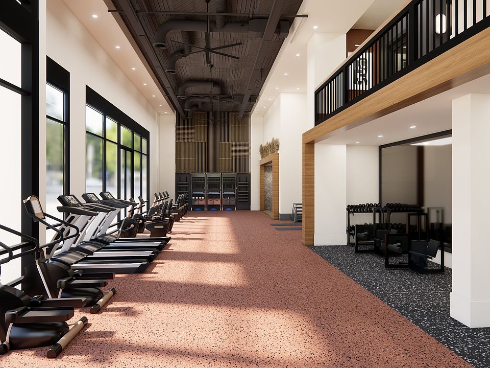 Club-quality fitness studio with spin bikes and yoga/pilates studio.