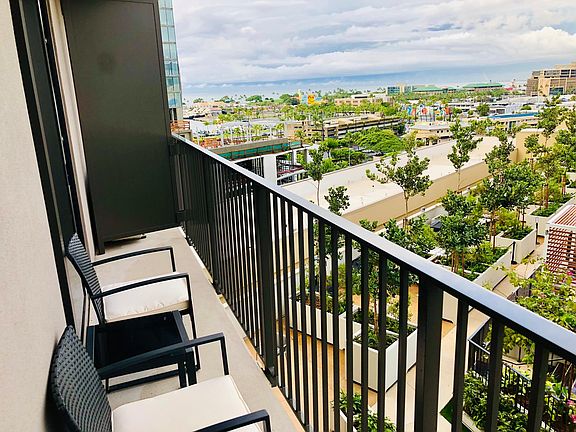 Enjoy your morning cup of coffee with partial ocean, sunset, pool and mountain views