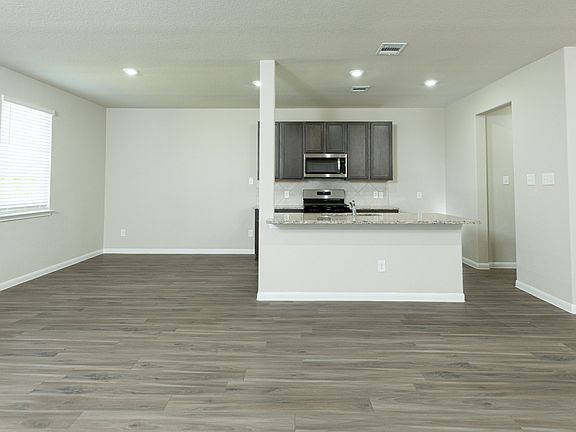 Family Room to Kitchen and Dining Area