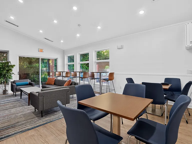 Elevate your lifestyle at Eagle Rock Apartments at Swampscott. This inviting communal area features modern furnishings, ample natural light, and a perfect space for relaxation or socializing. Explore your next home today!